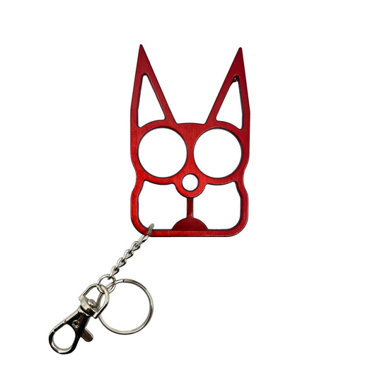 Pink cat-shaped metal knuckle keychain with finger holes and spikes for self-defense and key holding