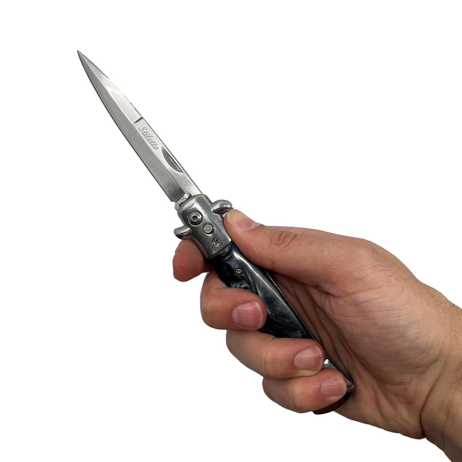 Person holding Stiletto automatic knife with black swirl handle and sharp stainless blade