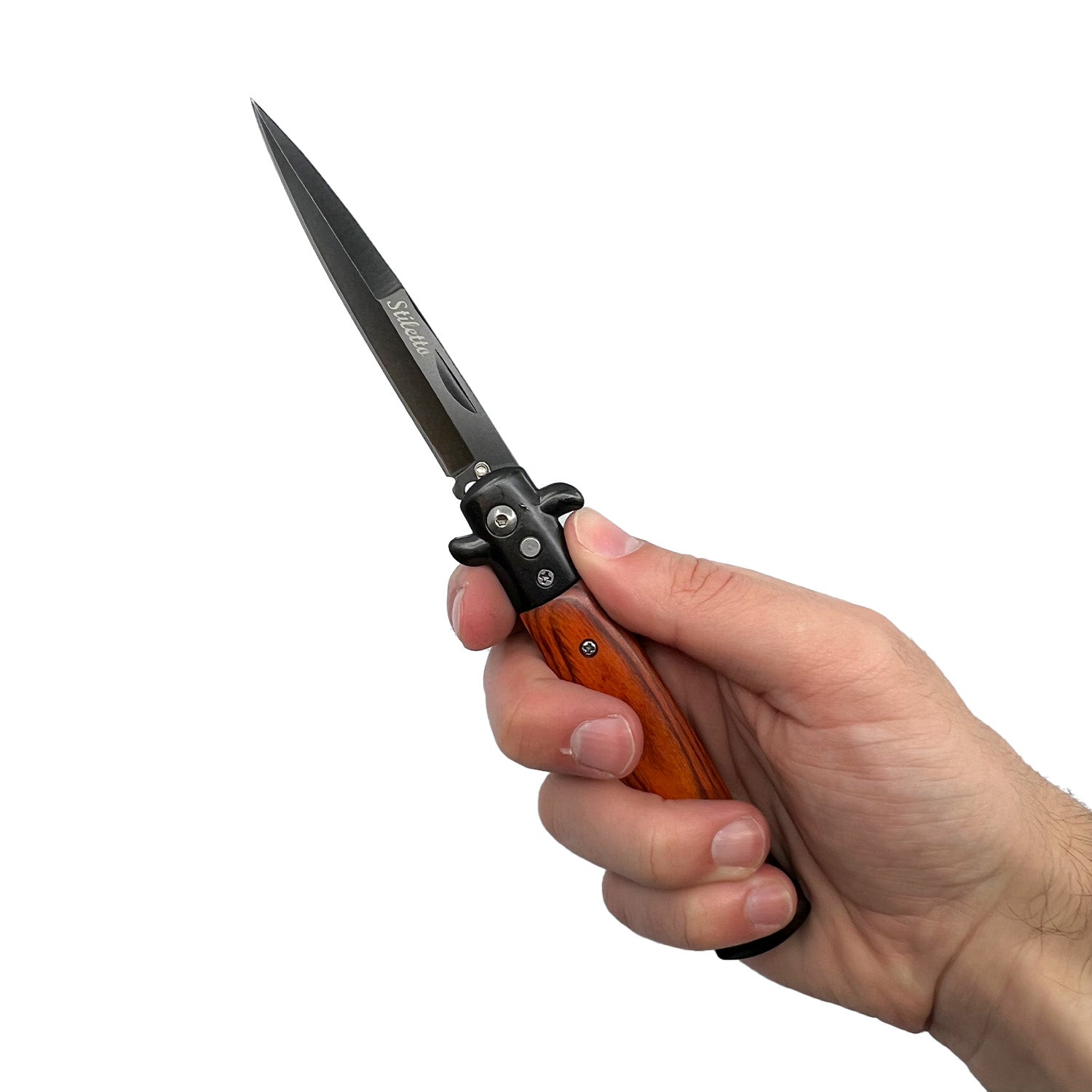 Person holding Stiletto automatic knife with wood handle and black stiletto blade